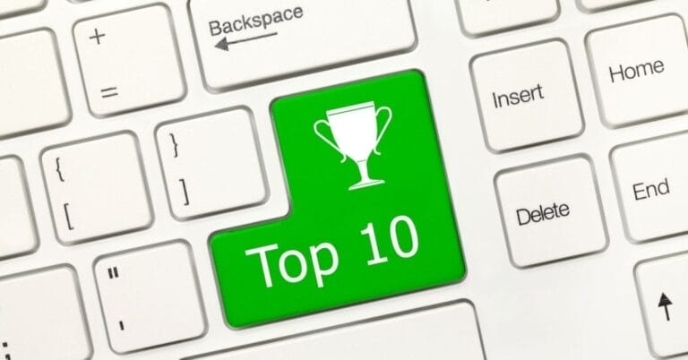 A keyboard with a green key labeled "Top 10" featuring a trophy icon, surrounded by white keys like "Backspace" and "Delete," symbolizes discovering the top free WordPress plugins.