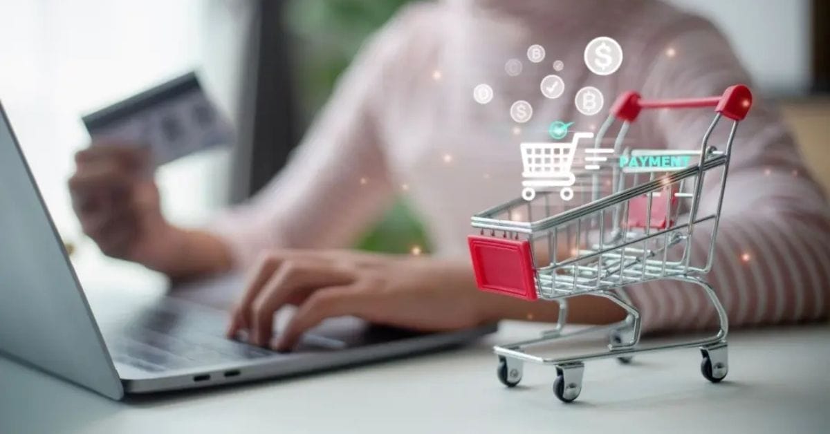 A person uses a laptop and holds a credit card, with a digital shopping cart and payment icons superimposed in the foreground—perfect for showcasing SendOwl digital products.