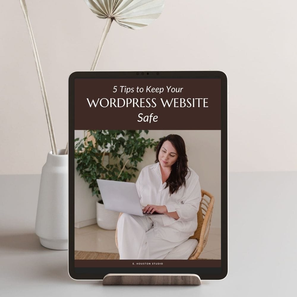 Tablet displaying "5 Tips to Keep Your WordPress Website Safe" with a woman sitting and using a laptop.