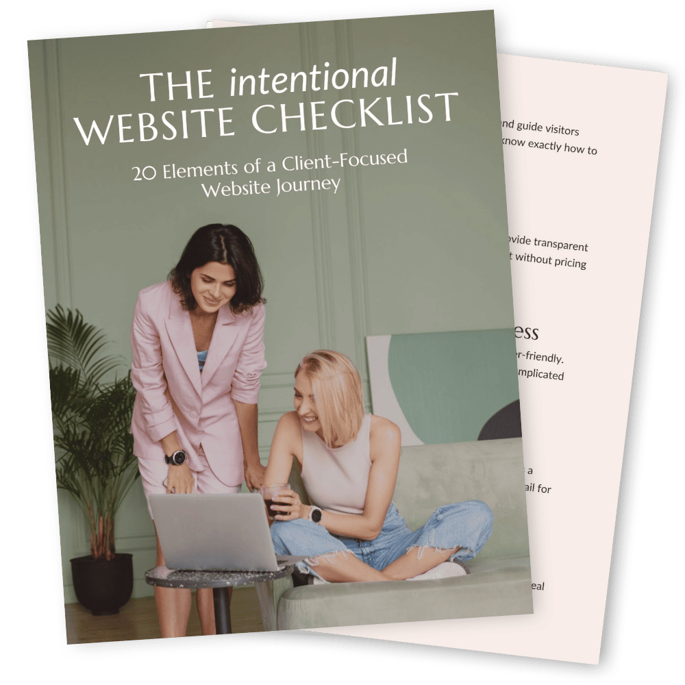 Two people looking at a laptop together with a book titled "The Intentional Website Checklist: 20 Elements of a Client-Focused Website Journey" in the foreground.