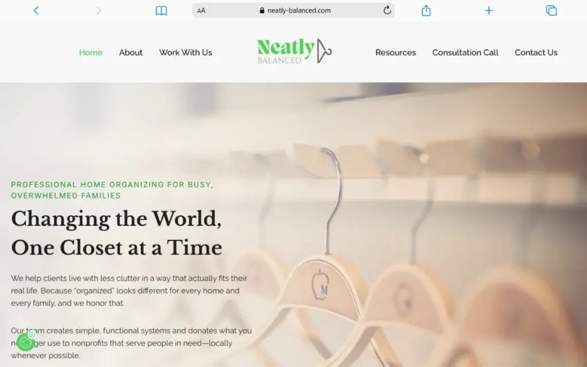 Website homepage for Neatly Balanced, featuring a blurred row of empty wooden hangers and text about professional home organizing for busy families.